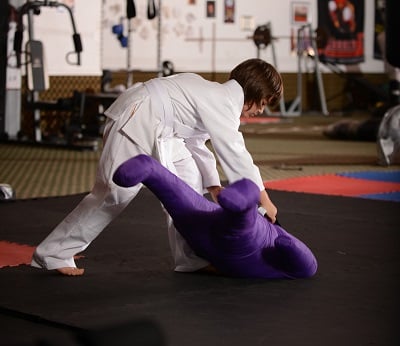 A child practices on the Century Martial Arts Junior Throwing Buddy.