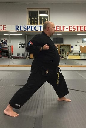 Kenkutsu dachi, or forward leaning, karate stance.