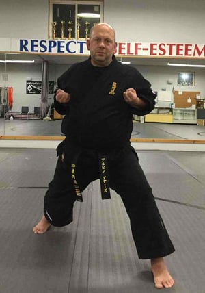 Kenkutsu dachi, or forward leaning, karate stance.