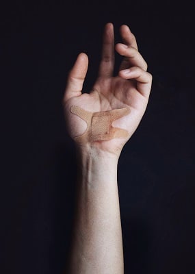 brian-patrick-tagalog-681929-unsplash Cover injuries with bandaids.