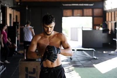 A man warms up for a martial arts workout.