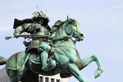 Image by Samuele Schirò from Pixabay. Statue of a samurai warrior astride a horse.