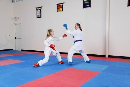 Karate sparring with Punok gloves and Century Martial Arts gi uniforms.
