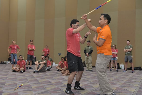 Master Apolo Ladra (orange shirt) demonstrates a kali pattern at the 2017 Martial Arts SuperShow.